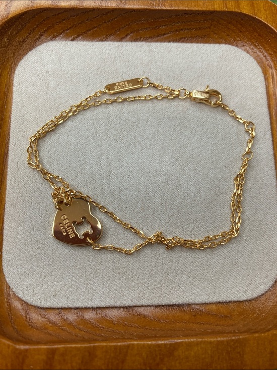 Celine Jewelry - Celine Gold Double-Chain Bracelet with Heart Cutout Charm
